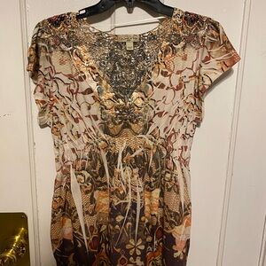 women’s tan and creme blouse